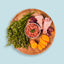 clock wise on platter. turkey organic, raw turkey legs, sweet potato, parsley. minced turkey in center 